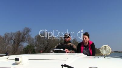 Men driving the boat, closeup