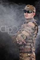 Military man on a black background