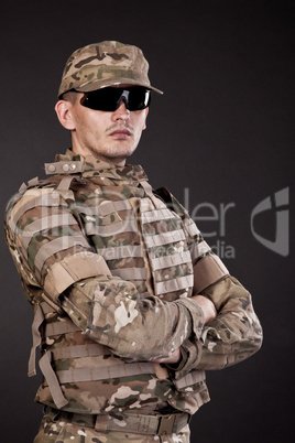 Military man on a black background