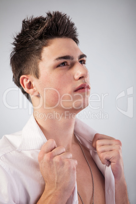 Healthy muscular young man on grey background