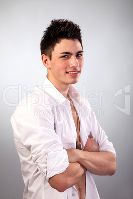 Healthy muscular young man on grey background