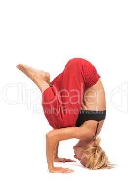 Practicing Yoga. Young woman isolated on white background