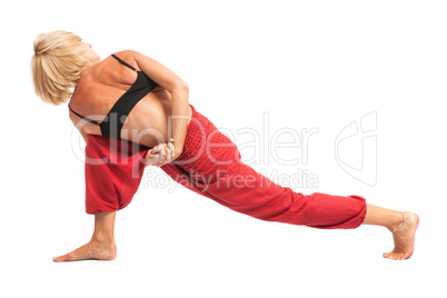 Practicing Yoga. Young woman isolated on white background