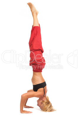 Practicing Yoga. Young woman isolated on white background