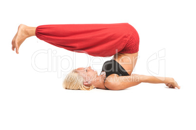 Practicing Yoga. Young woman isolated on white background