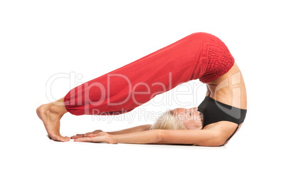 Practicing Yoga. Young woman isolated on white background