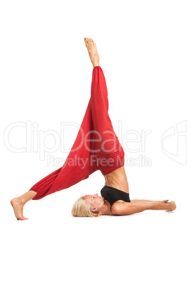 Practicing Yoga. Young woman isolated on white background