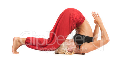 Practicing Yoga. Young woman isolated on white background