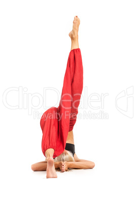 Practicing Yoga. Young woman isolated on white background