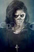 Young woman in day of the dead mask skull. Halloween face art