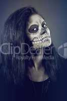 Young woman in day of the dead mask skull. Halloween face art