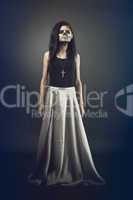 Young woman in day of the dead mask skull. Halloween face art