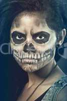 Young woman in day of the dead mask skull. Halloween face art