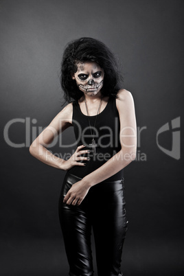 Young woman in day of the dead mask skull. Halloween face art