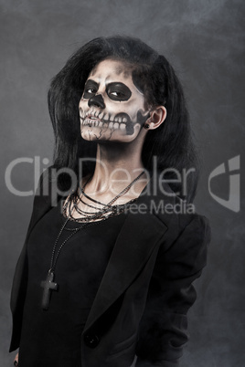 Young woman in day of the dead mask skull. Halloween face art