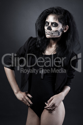 Young woman in day of the dead mask skull. Halloween face art