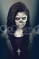 Young woman in day of the dead mask skull. Halloween face art