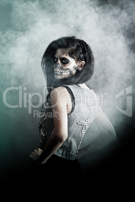 Young woman in day of the dead mask skull. Halloween face art