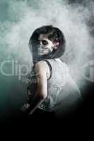 Young woman in day of the dead mask skull. Halloween face art