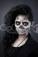 Young woman in day of the dead mask skull. Halloween face art