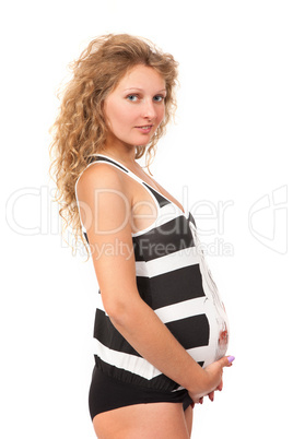 Pregnant woman is caressing her belly