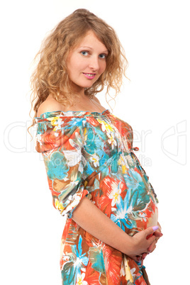 Pregnant woman is caressing her belly