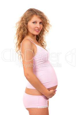 Pregnant woman is caressing her belly