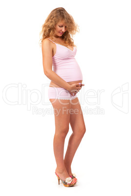 Pregnant woman is caressing her belly