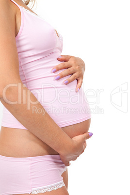 Pregnant woman is caressing her belly