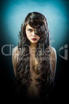 Beautiful brunette Asian woman with long black hair