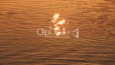 Sun reflection in water surface, tranquil scene