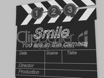 Movie production clapper board notifying to the people that smil