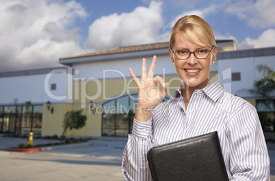 Businesswoman In Front of Vacant Office Building