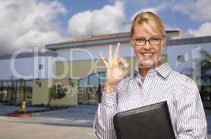 Businesswoman In Front of Vacant Office Building