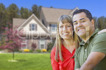 Happy Mixed Race Couple in Front of House