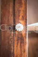 Closeup of old fashioned door knob on wooden door