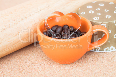 Heart cookies cutter in cup of coffee bean