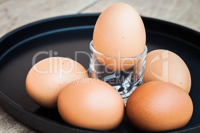 Many eggs in a black tray