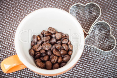 Mug cup of coffee grain on a grunge background