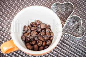Mug cup of coffee grain on a grunge background
