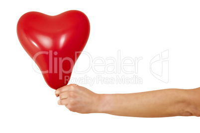 Hand holding red heart