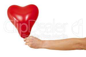 Hand holding red heart