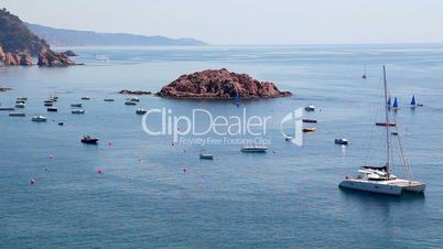 Seashore of Tossa de Mar, boats and catamaran, Costa Brava in Catalonia, Spain