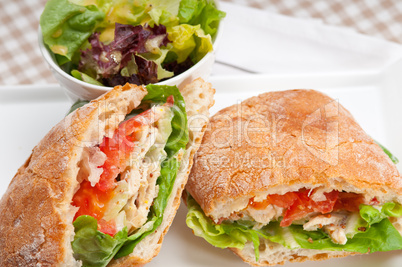 ciabatta panini sandwich with chicken and tomato