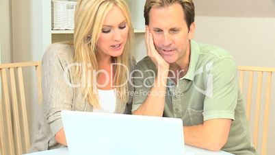 Attractive Couple Happy with Their Financial Planning