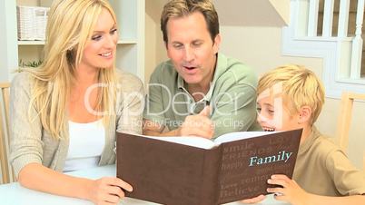 Young Caucasian Family with Photograph Album
