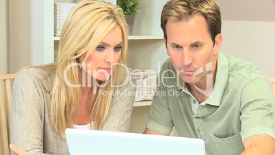 Young Couple Seeking Financial Solutions