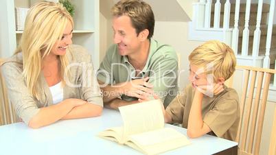 Young Caucasian Family Sitting with a Book