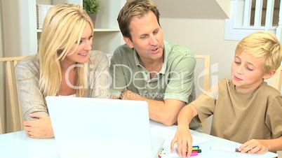 Young Blonde Boy with Parents Using Color Pens