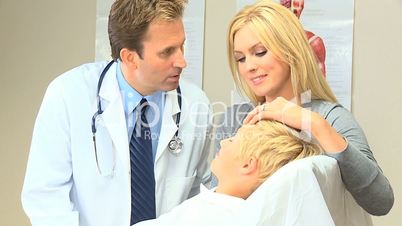 Little Caucasian Boy with Mother at Family Clinic